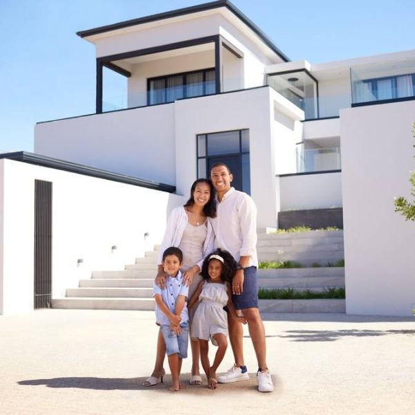 portrait, real estate and happy family moving into their new luxury home, house or property in summ